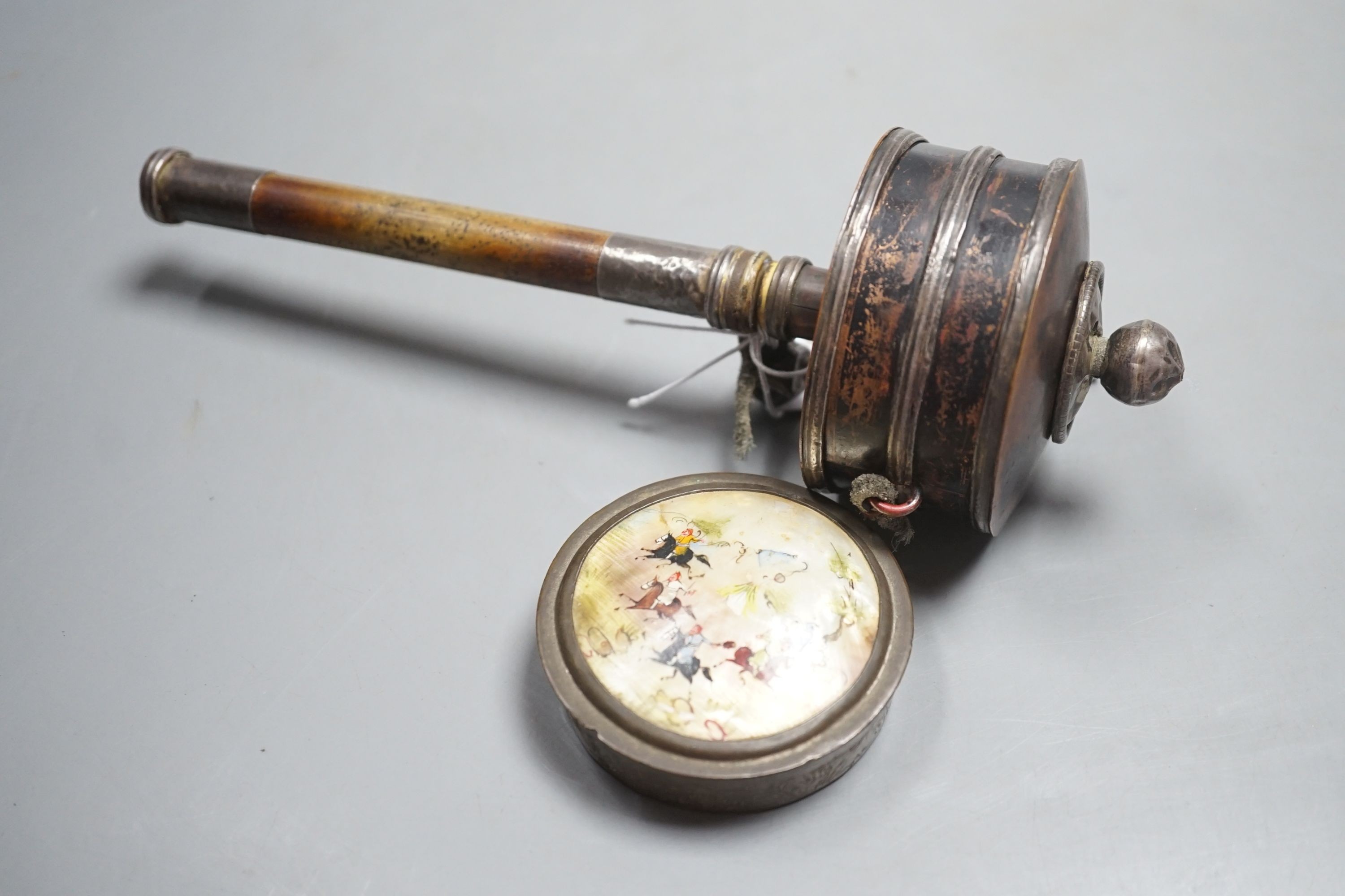 A 19th century Tibetan white metal mounted copper prayer wheel with interior script and a Persian painted mother-of-pearl pill box